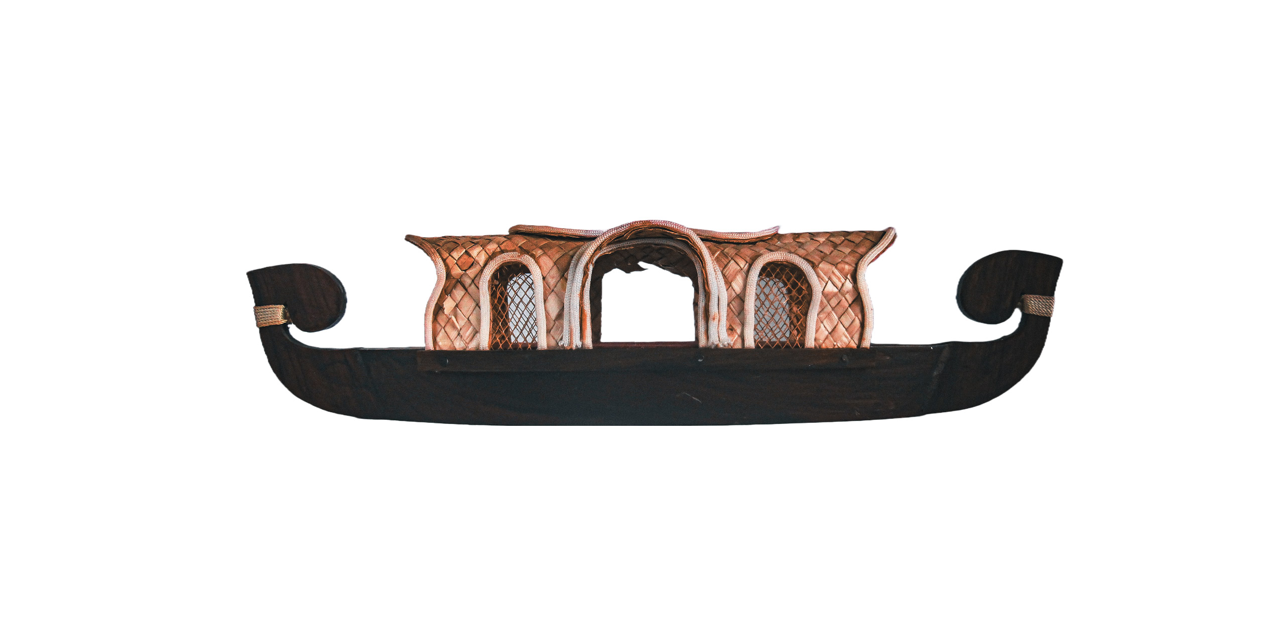 Long Kettuvallam-inspired boat sculpture on a white background